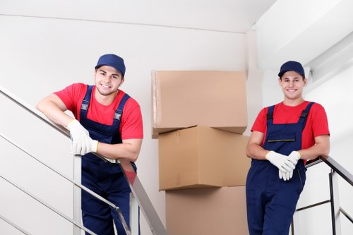 Boxes and furniture being packed into a mobile storage unit