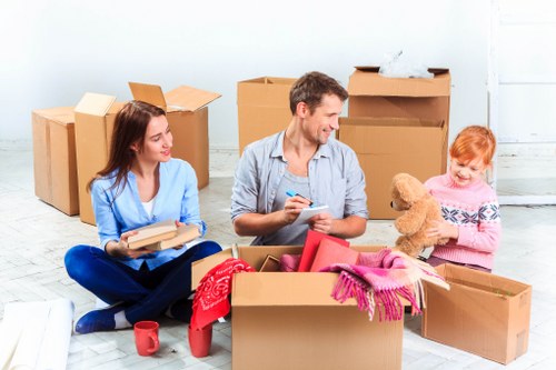 Local removals support for a move in Swiss Cottage with packed boxes and a moving van
